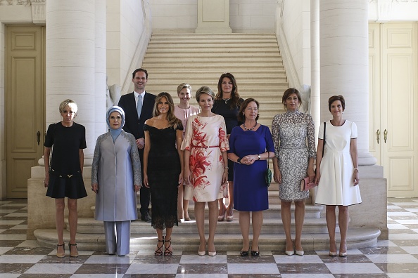 BRUSSELS, BELGIUM - MAY 25 : (Front row L to R) First Lady of France Brigitte Macron, First Lady of Turkey Emine Erdogan, First Lady of the US Melania Trump, Queen Mathilde of Belgium, Stoltenbergs partner Ingrid Schulerud, Partner of Bulgarias President Desislava Radeva, partner of Charles Michel Amelie Derbaudrenghien, (back row, LtoR) First Gentleman of Luxembourg Gauthier Destenay, partner of Slovenias Prime Minister Mojca Stropnik and First Lady of Iceland Thora Margret Baldvinsdottir pose for a family photo before a diner of the First Ladies and Queen at the Royal castle in Brussels, Belgium on May 25, 2017. (Photo by Turkish Presidency / Handout/Anadolu Agency/Getty Images)