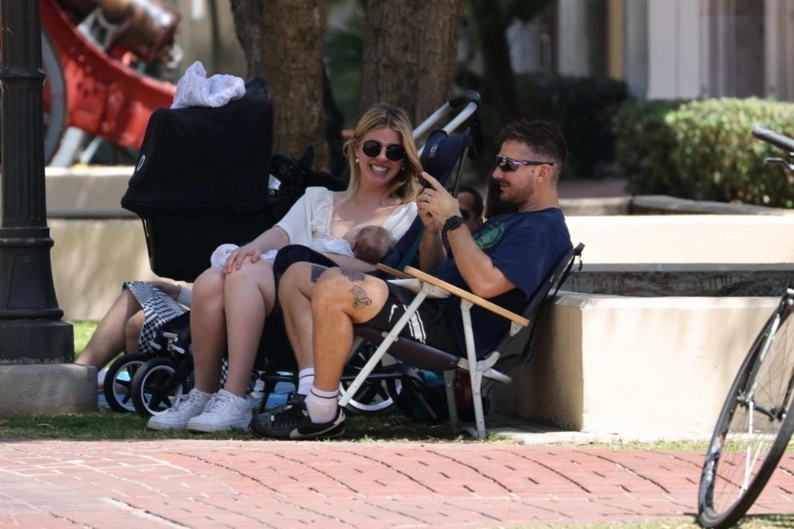 Family idyll: Hollywood tycoon Shia LaBeouf is seen walking with girlfriend and child