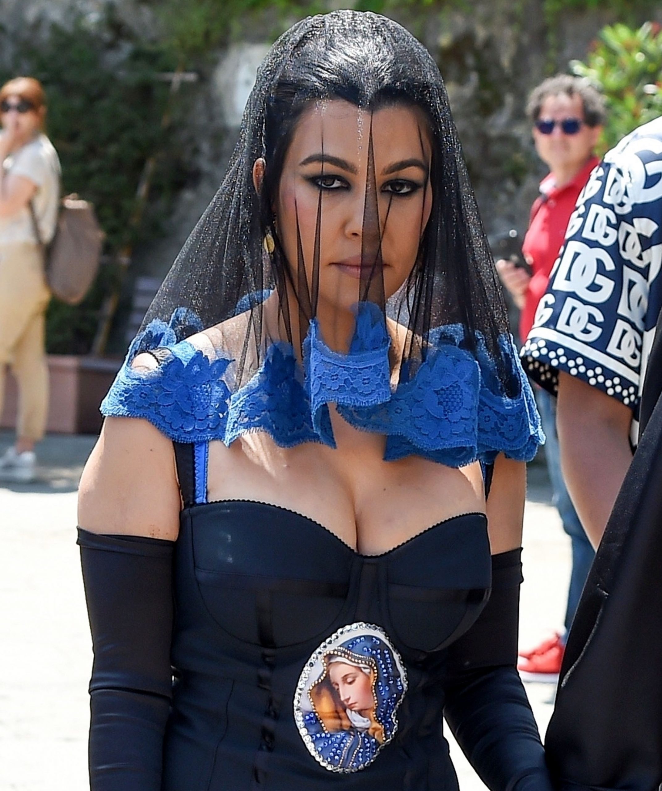 Kourtney Kardashian echoed the image of Kim wearing a gorgeous mini with the image of the Virgin Mary.