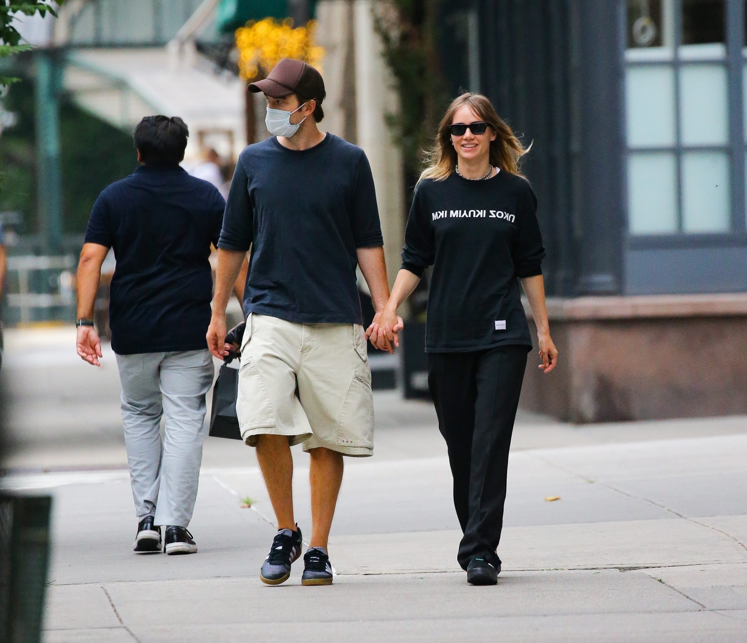 Rare exit: Robert Patisson and girlfriend Suki Waterhouse holding hands while walking in New York